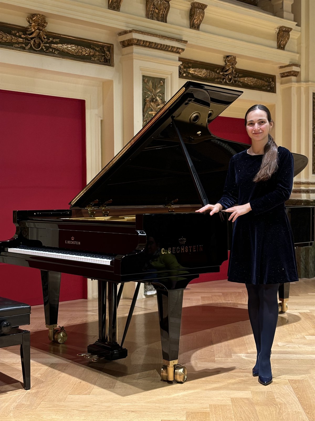 Angela Todorova beside a C. Bechstein grand piano in the Ehrbar Saal, Vienna