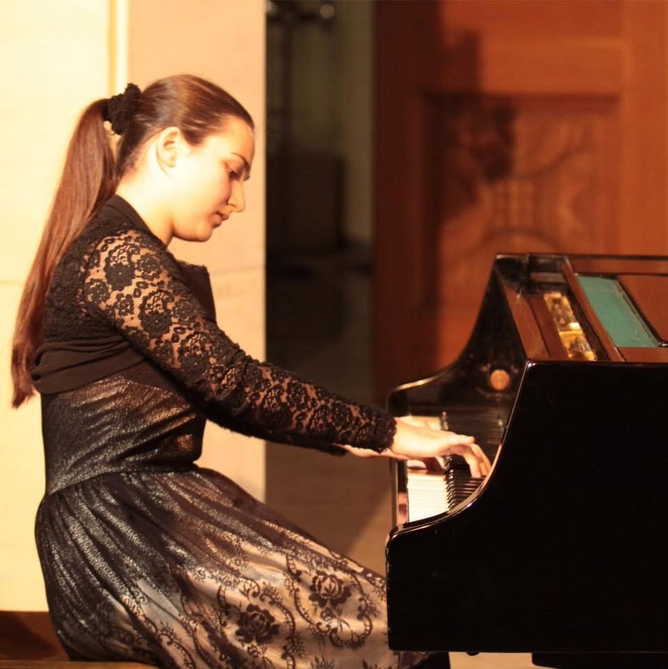 Angela Todorova in profile at the keyboard in lace