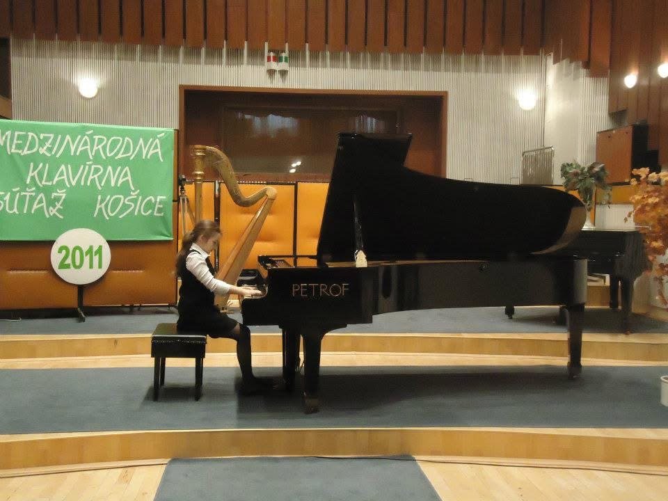 Angela Todorova as a child playing a PETROF grand piano at a competition in Košice