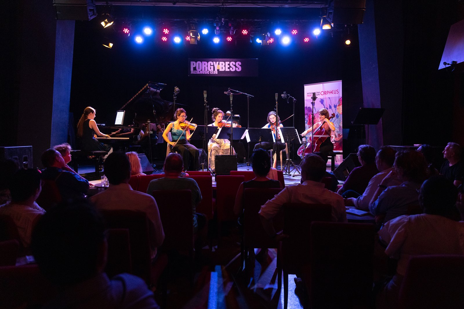 Angela Todorova at the piano with a string quartet on the Porgy & Bess stage in Vienna