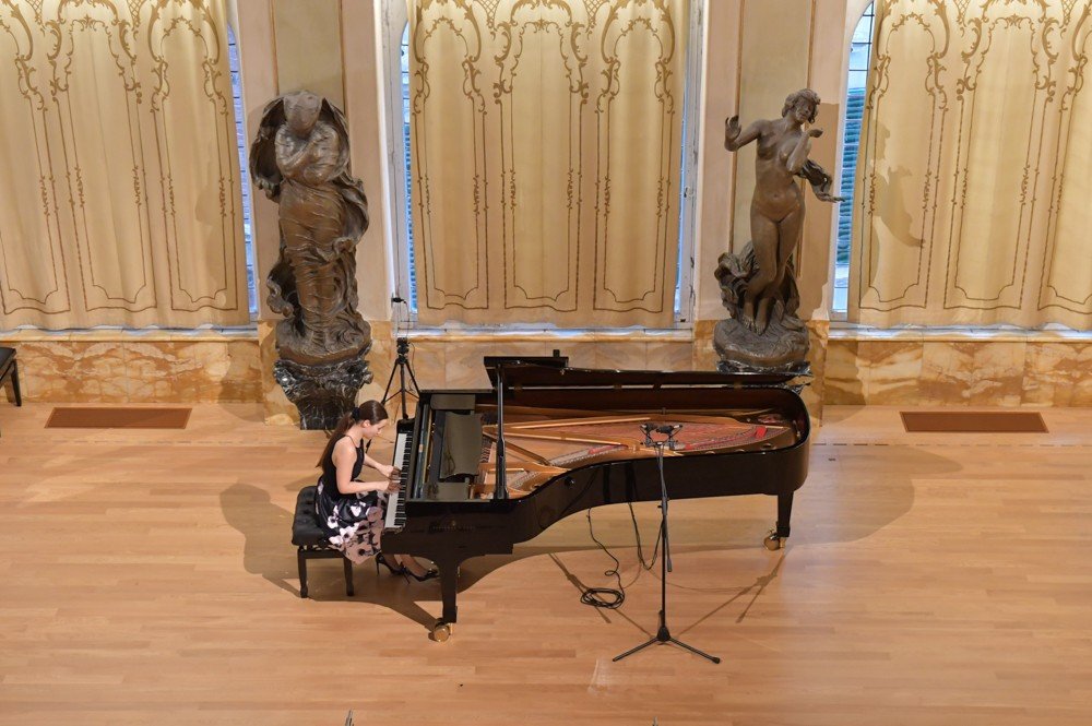Angela Todorova at the grand piano, seen from the balcony of a recital hall