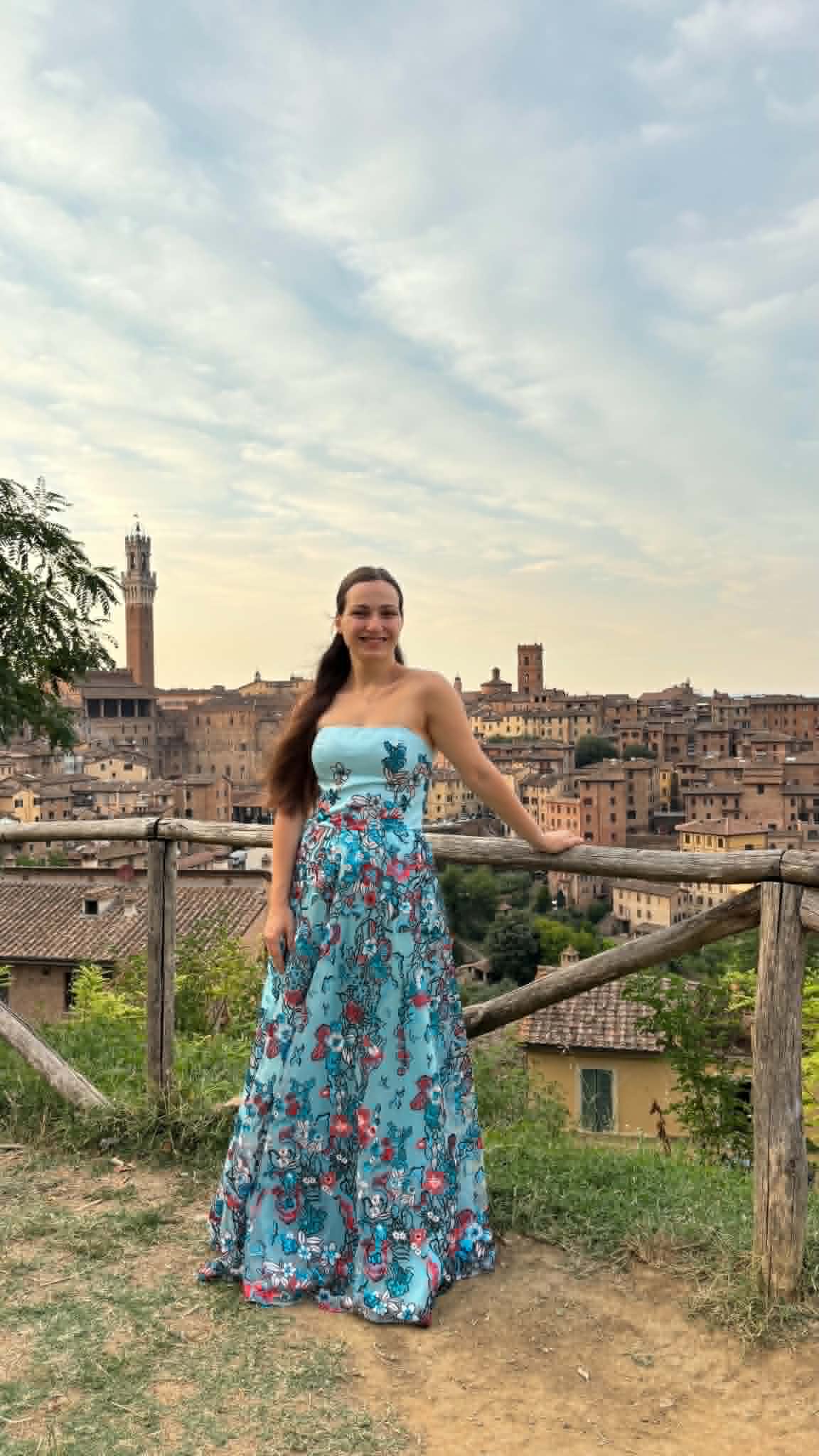 Angela Todorova with the town of Siena behind her
